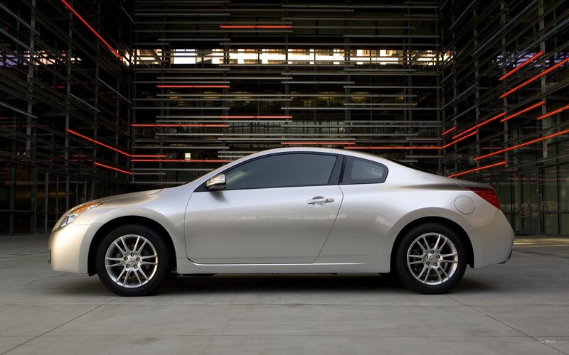 silver coupe in modern setting