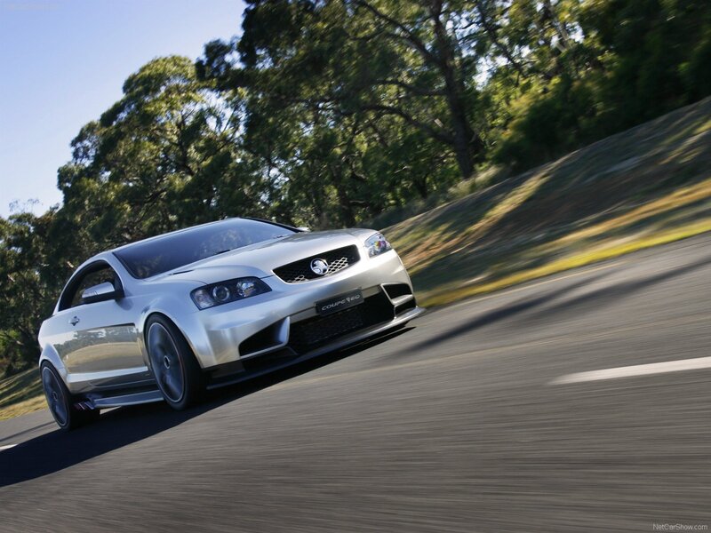 silver coupe in motion