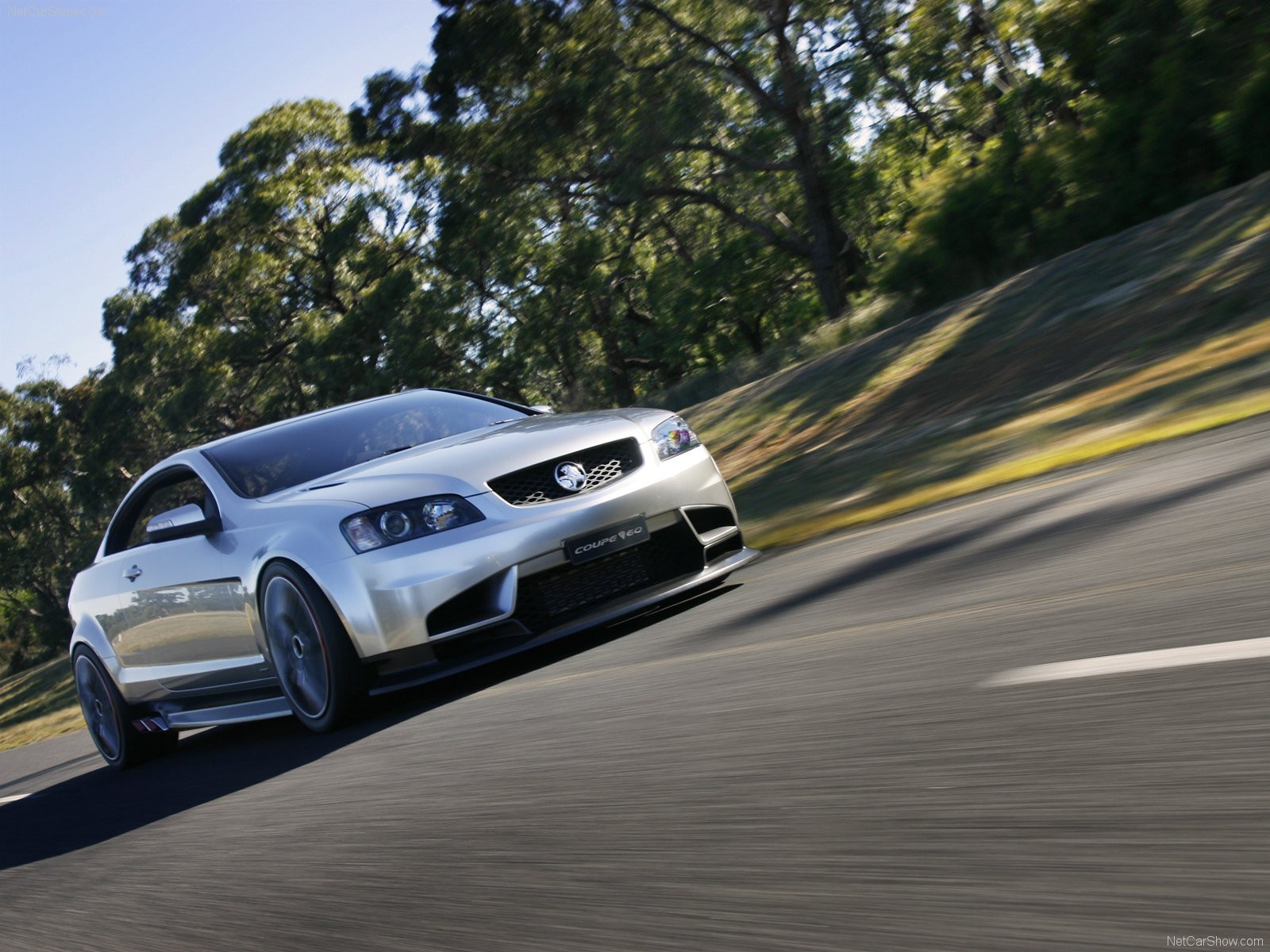 silver coupe in motion
