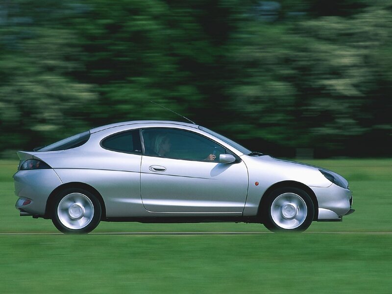 silver coupe in motion