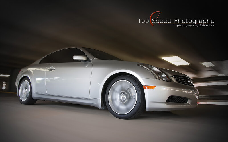 silver coupe in motion