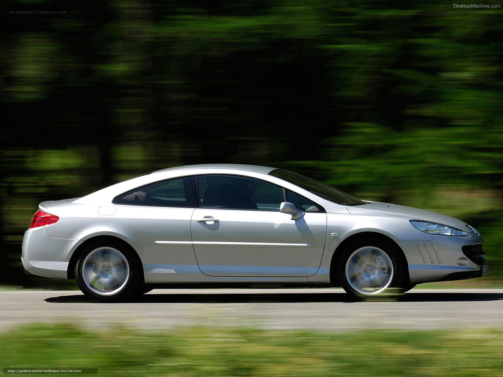 silver coupe in motion