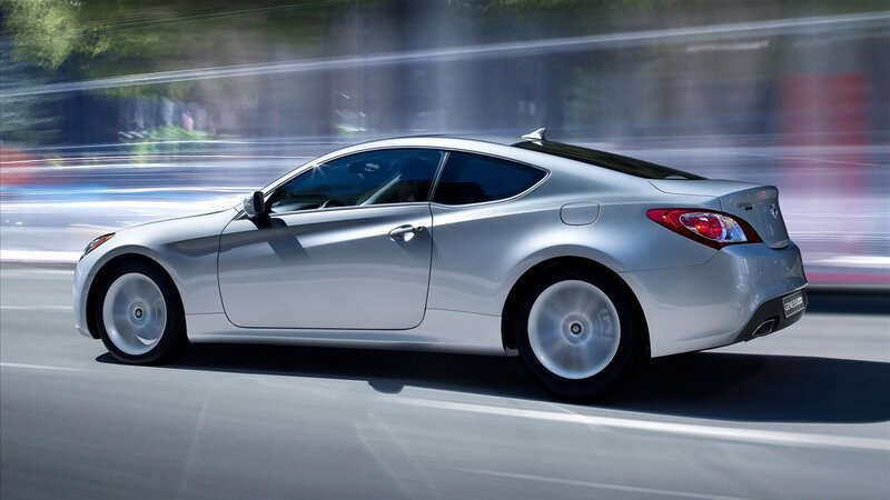 silver coupe in motion