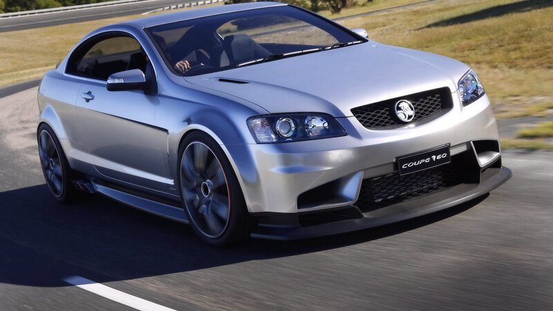 silver coupe in motion