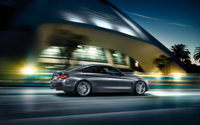 silver coupe in motion at night