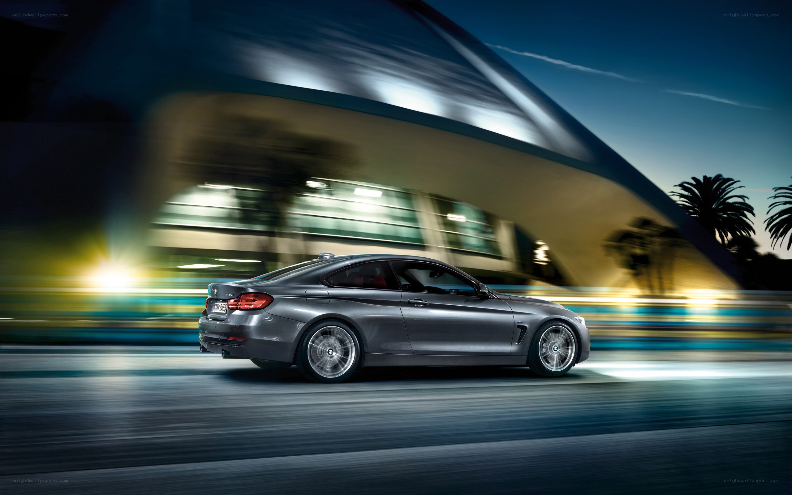 silver coupe in motion at night