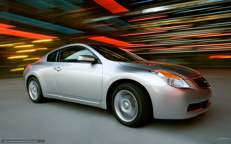 Silver coupe in motion