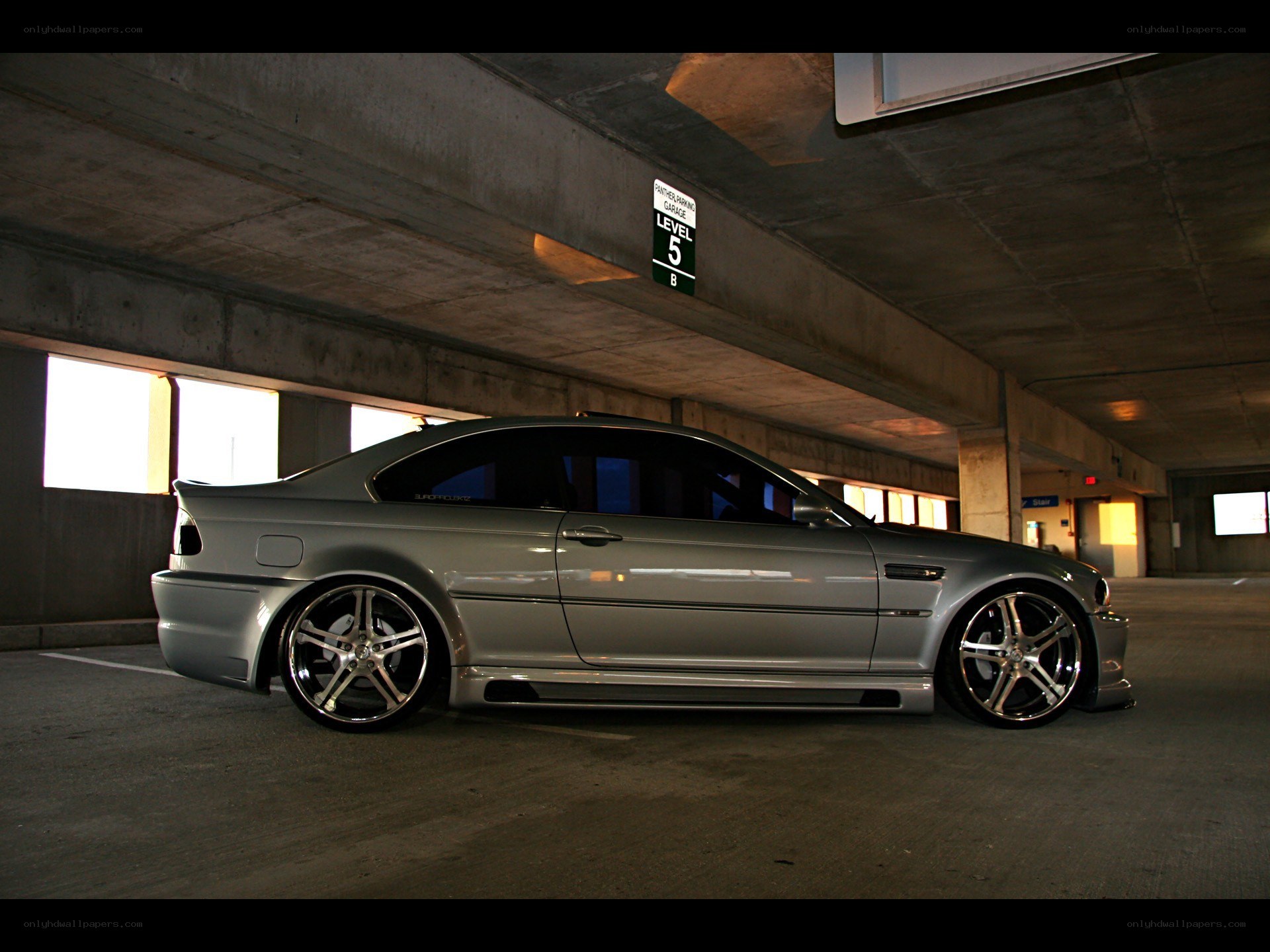 silver coupe in parking garage