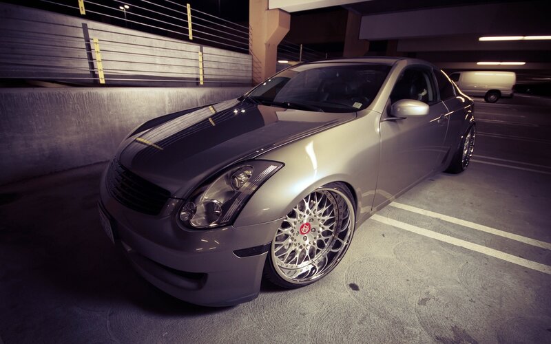 silver coupe in parking garage