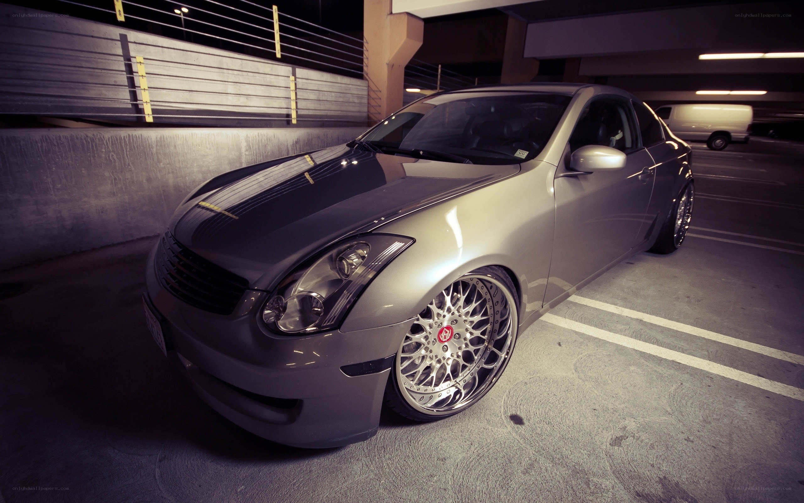 silver coupe in parking garage