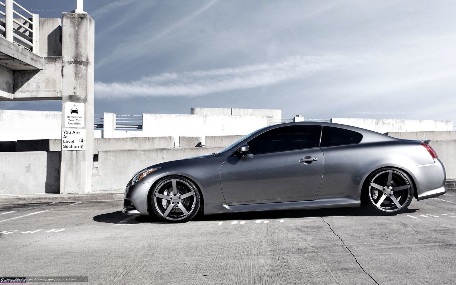 silver coupe in parking garage