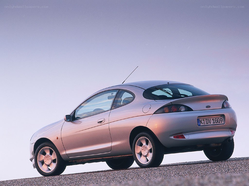 silver coupe on a hill