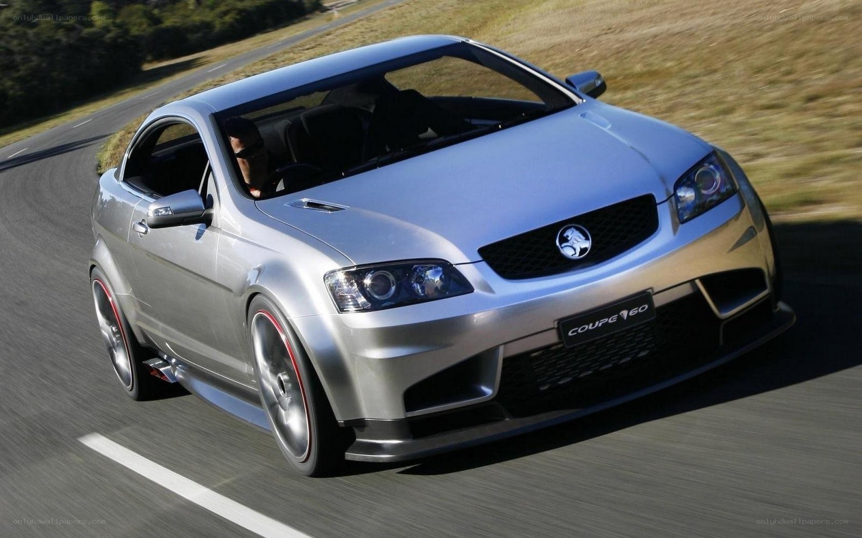 silver coupe on a road