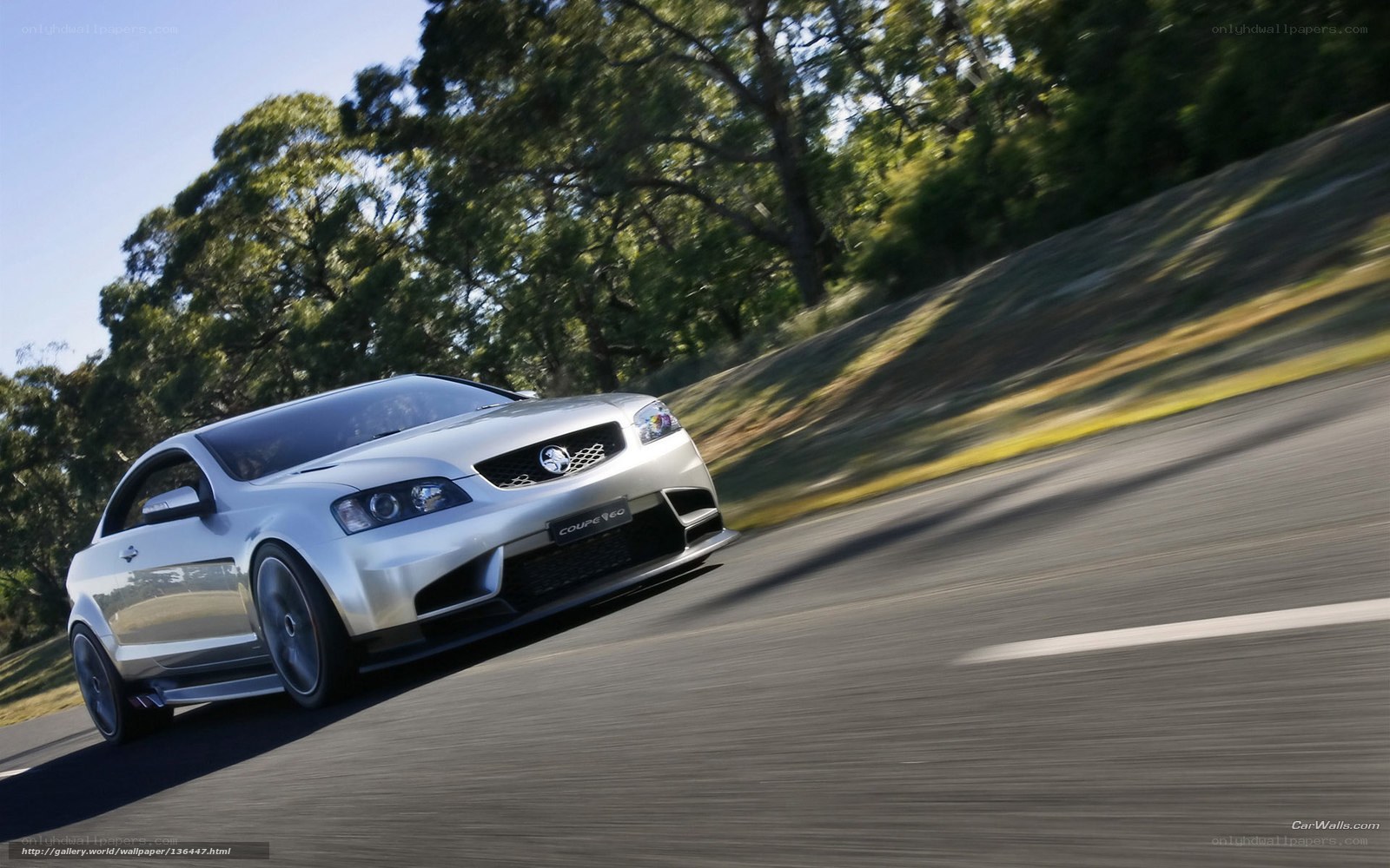silver coupe on a road