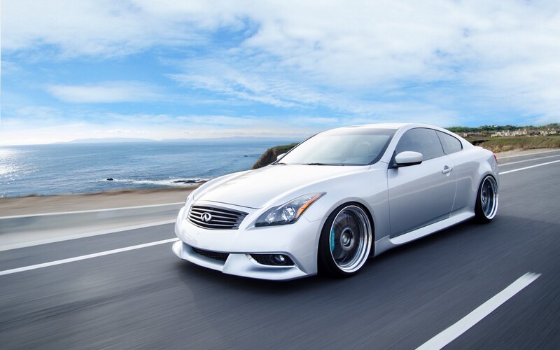 Silver Coupe on Coastal Road — White