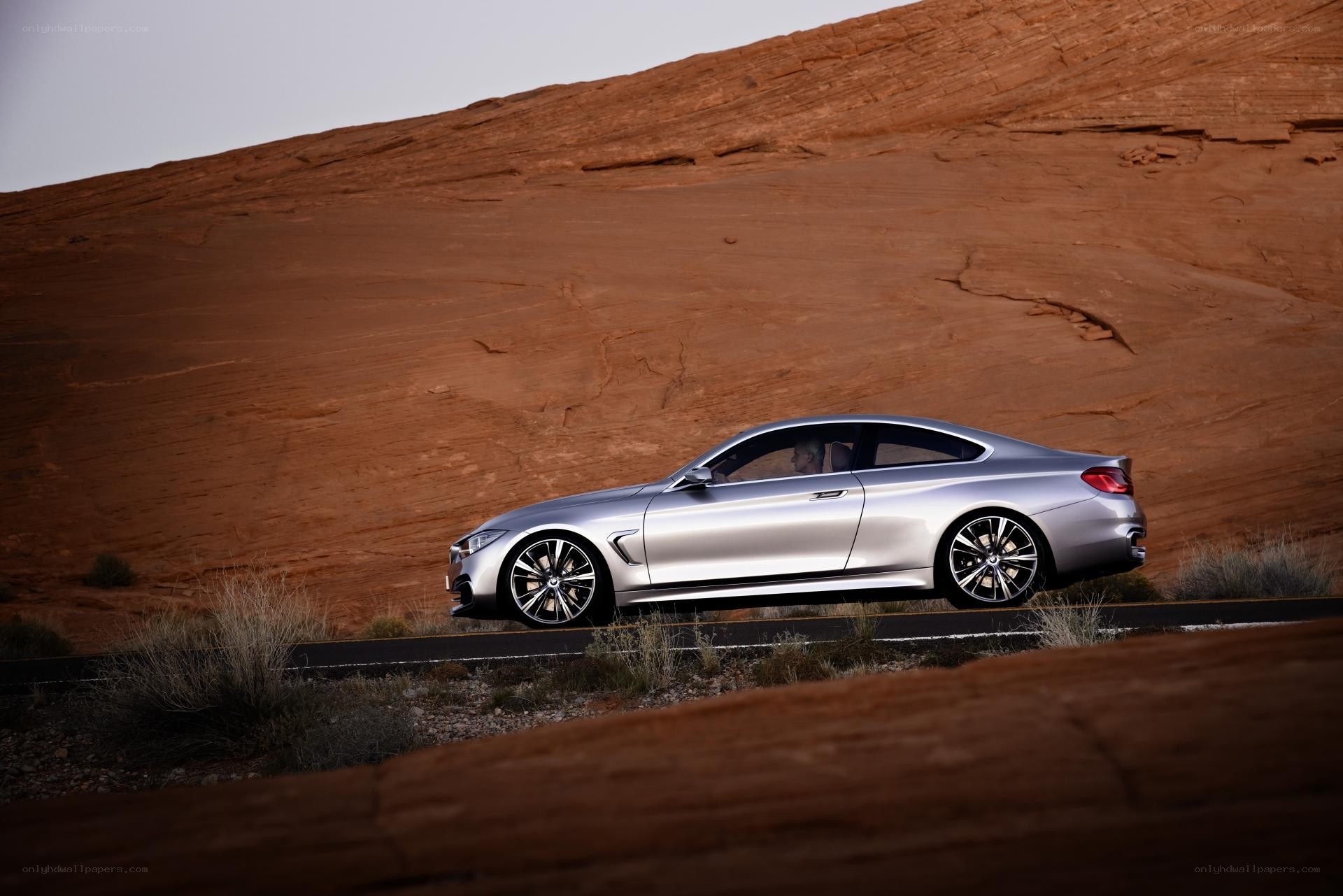 Silver coupe on desert road