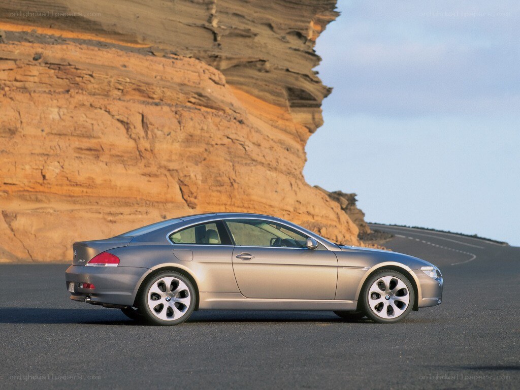 silver coupe on desert road