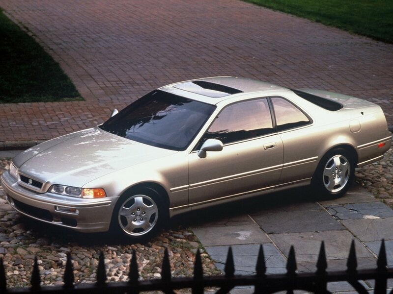 silver coupe on driveway
