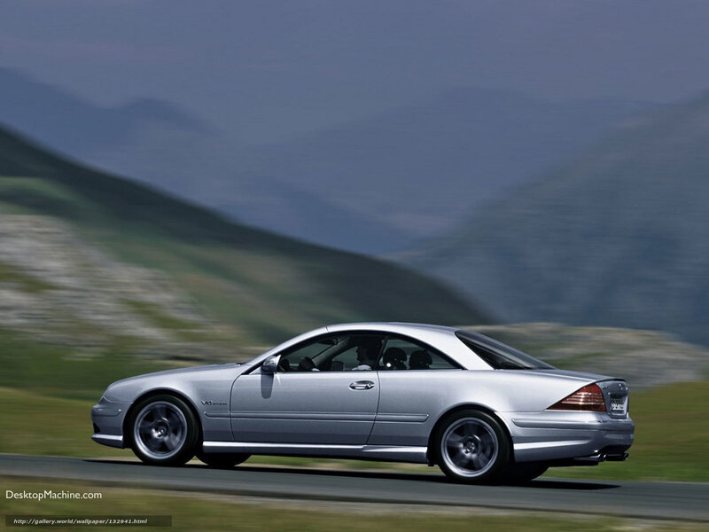 silver coupe on mountain road
