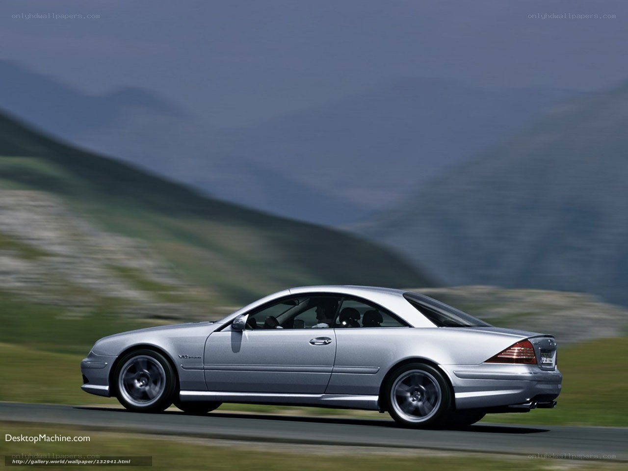 silver coupe on mountain road