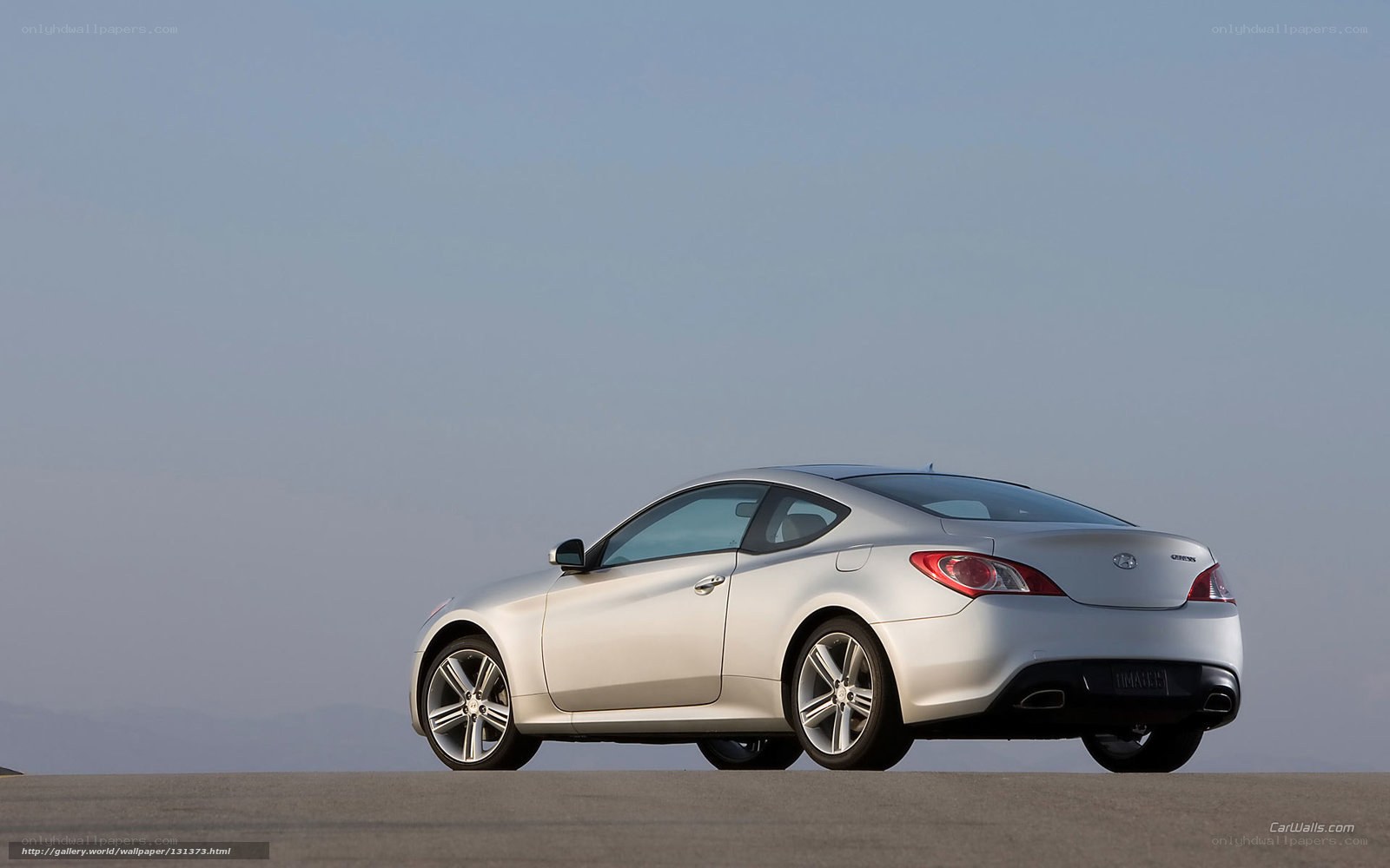 silver coupe on open road