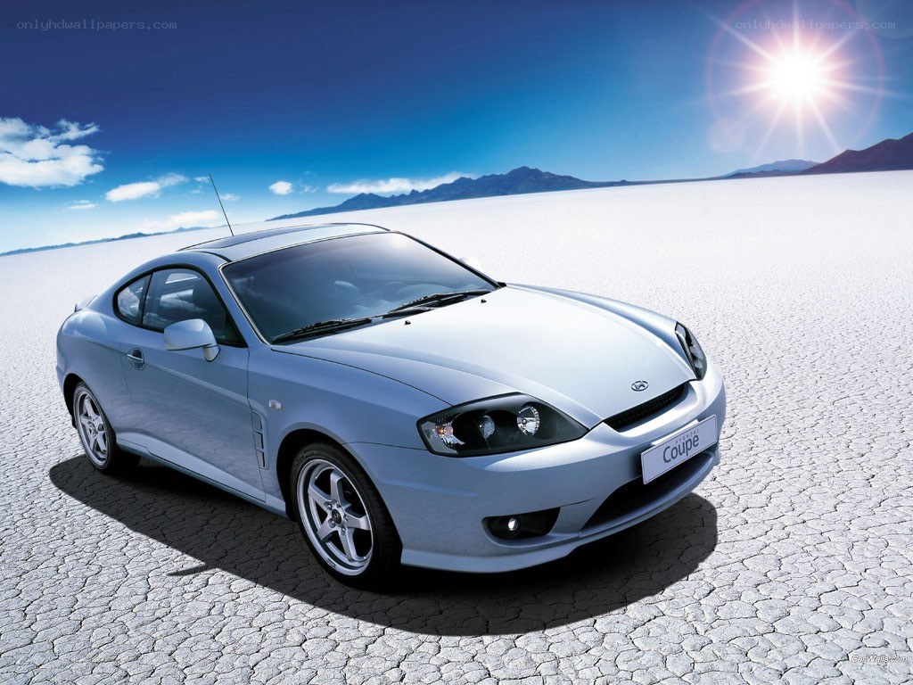 Silver coupe on salt flat