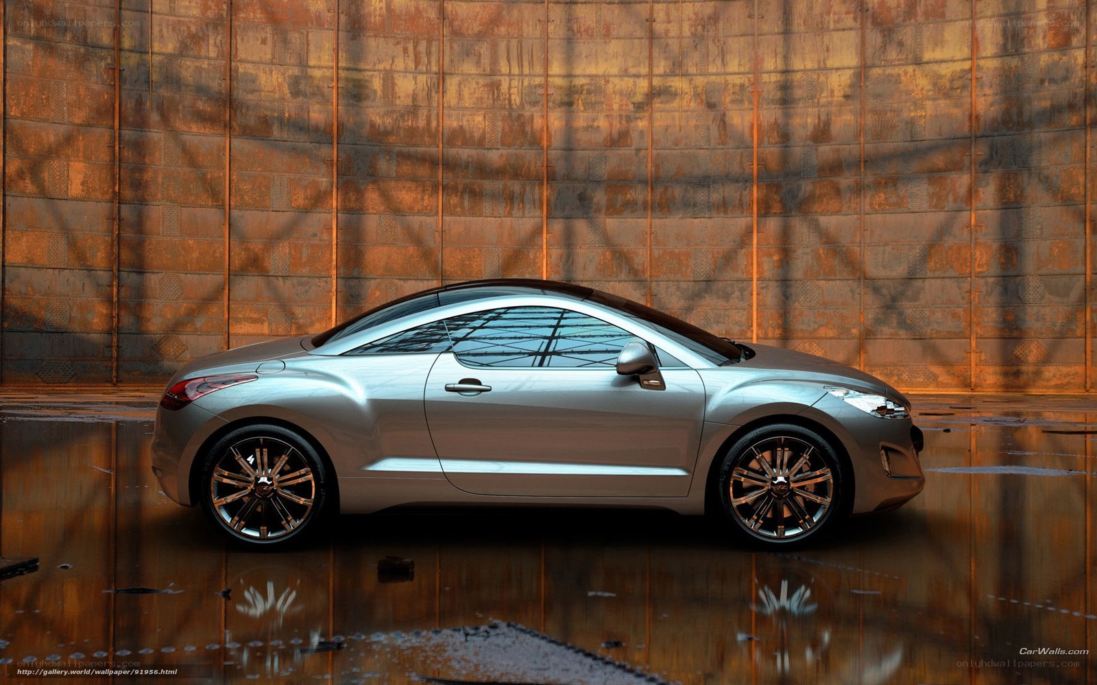 Silver coupe on wet pavement