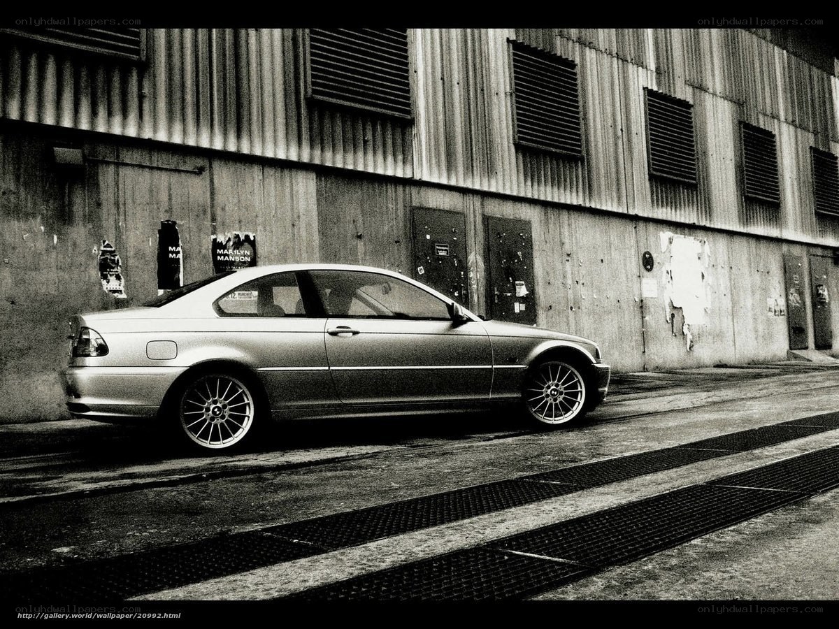 silver coupe parked in alley