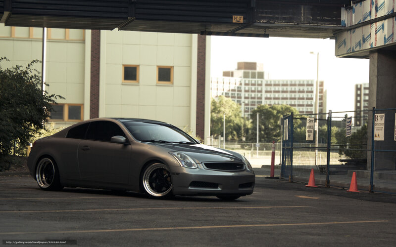 silver coupe under overpass