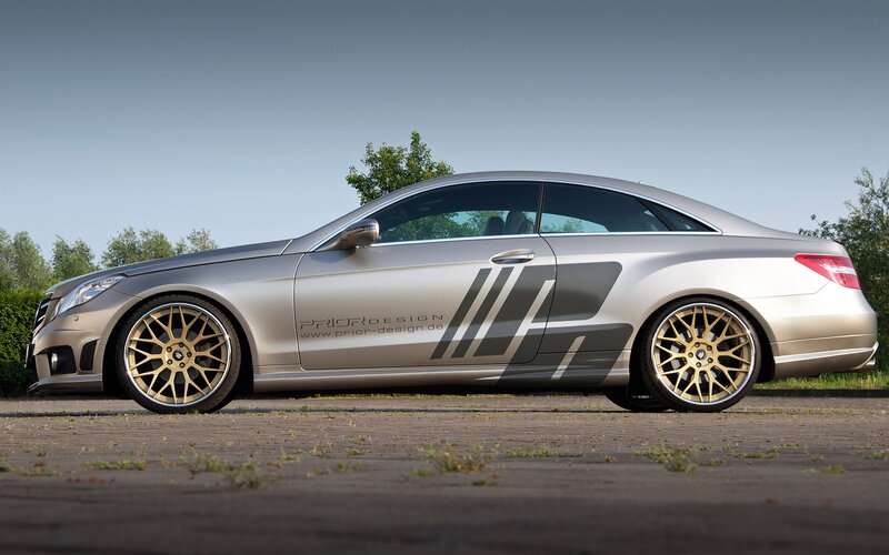 silver coupe with gold wheels