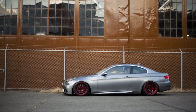 silver coupe with red wheels