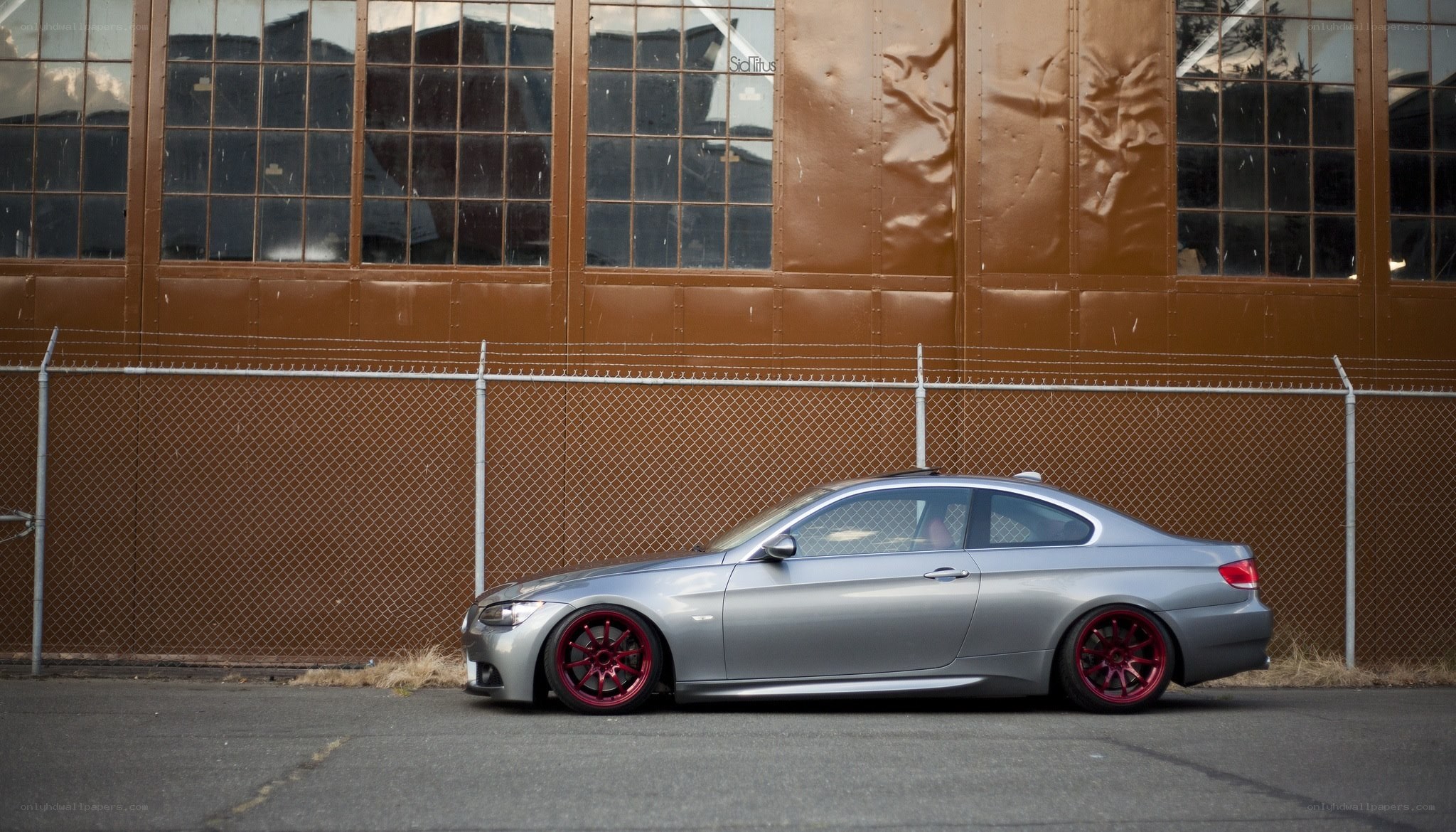 silver coupe with red wheels