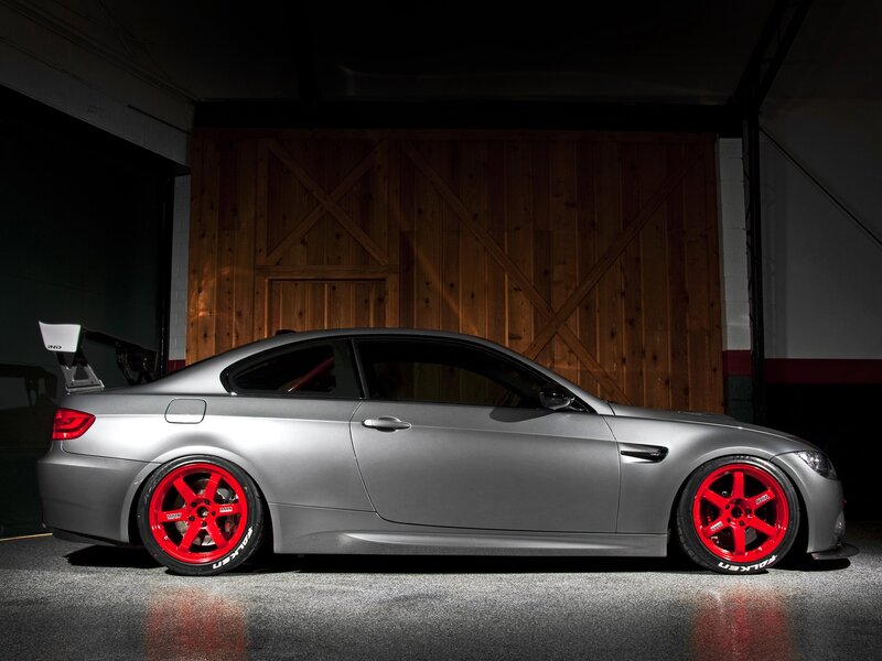 silver coupe with red wheels