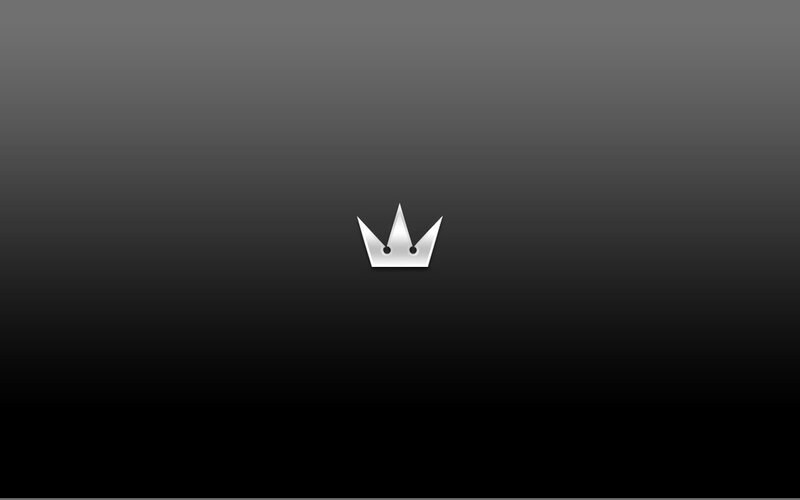 silver crown logo on dark background