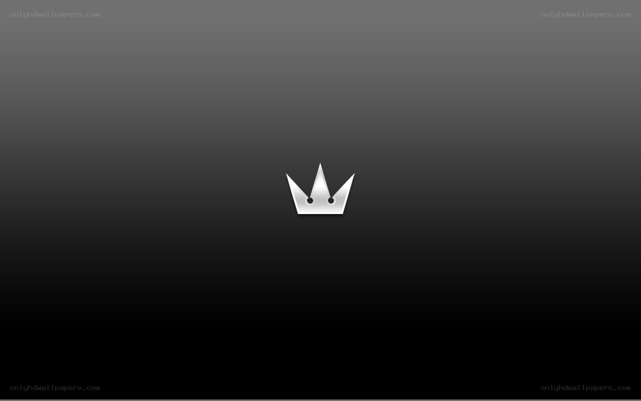 silver crown logo on dark background
