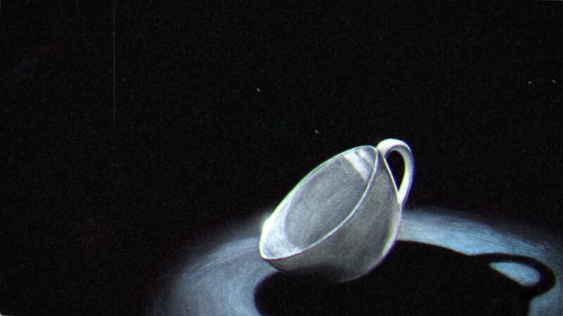 Silver Cup on Dark Surface