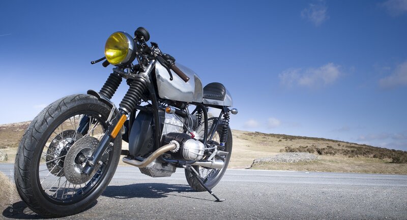 silver custom motorcycle on road
