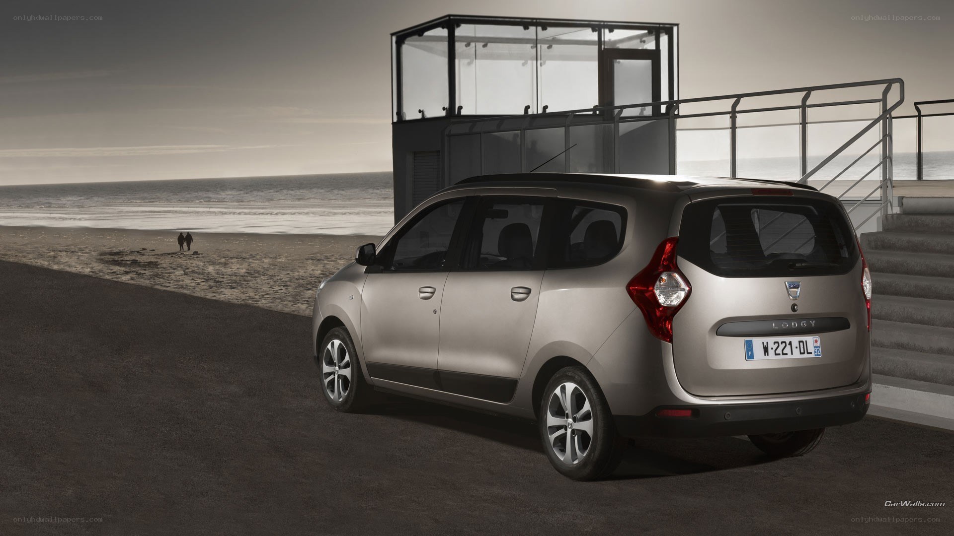 Silver Dacia Lodgy on beach