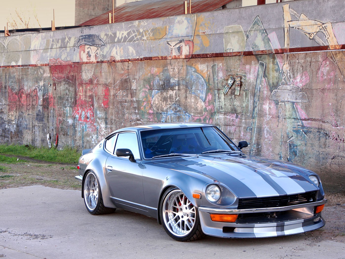 Silver Datsun with racing stripes