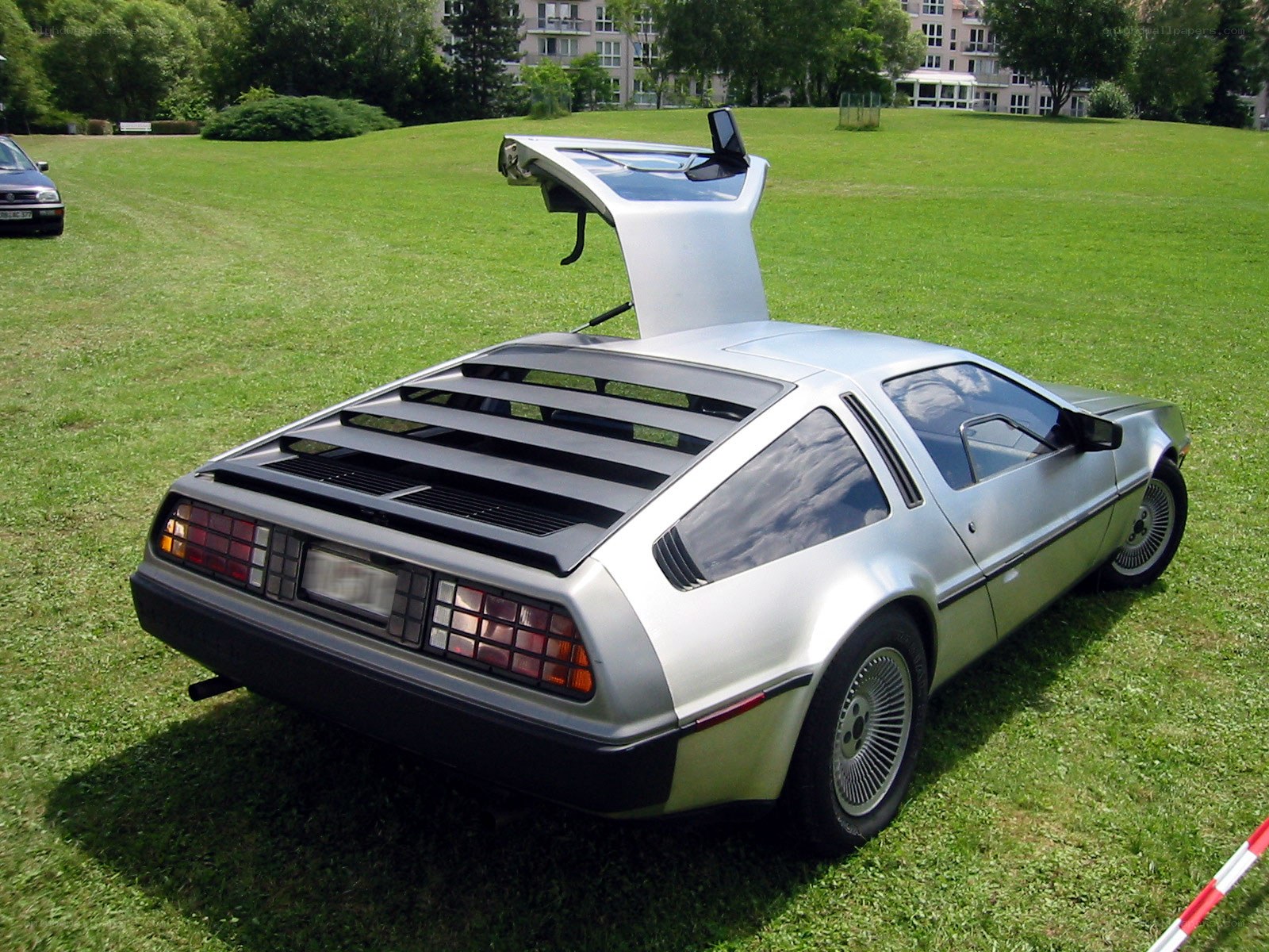 Silver DeLorean with gullwing door