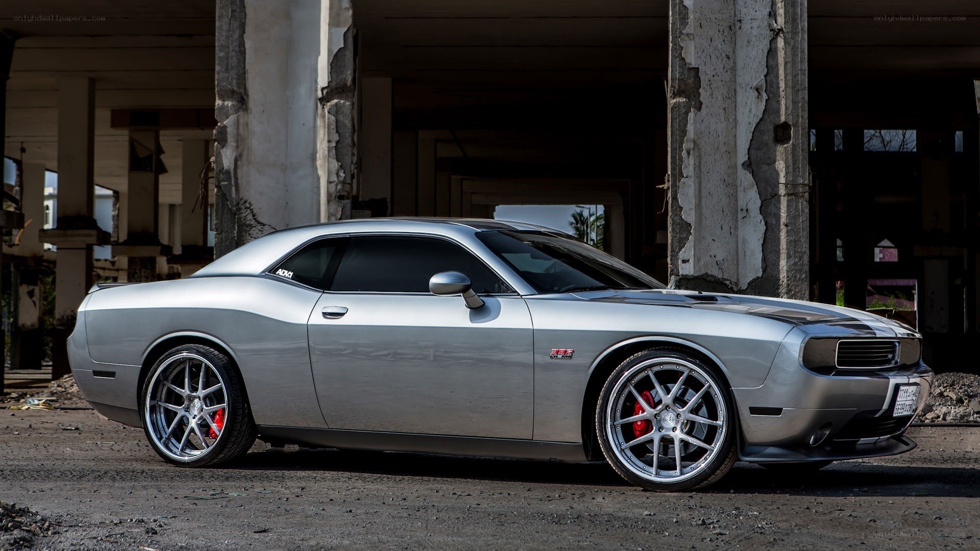 Silver Dodge Challenger in abandoned building