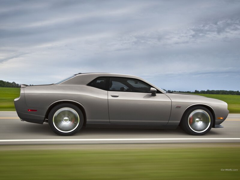 silver dodge challenger in motion
