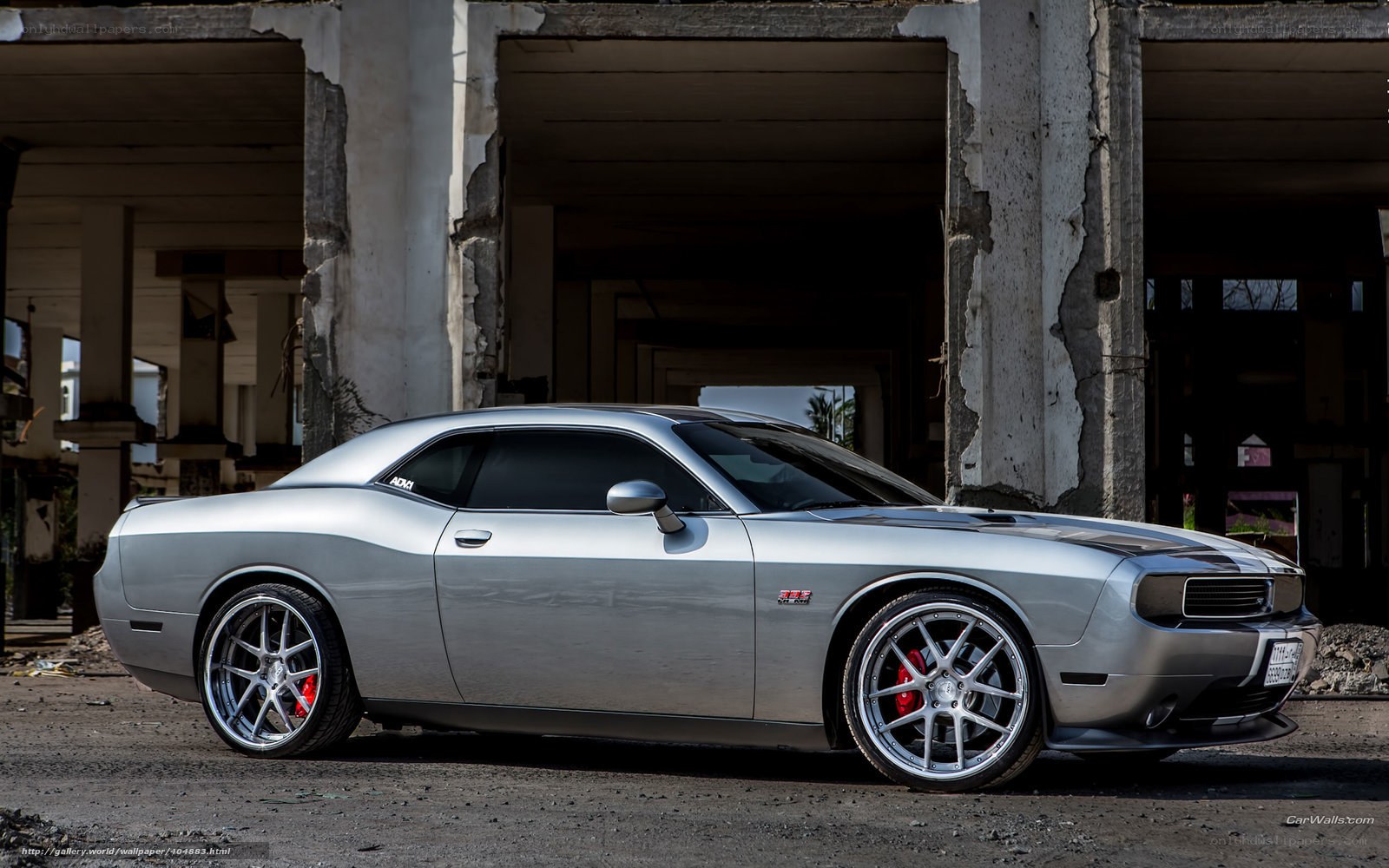 Silver Dodge Challenger in ruins