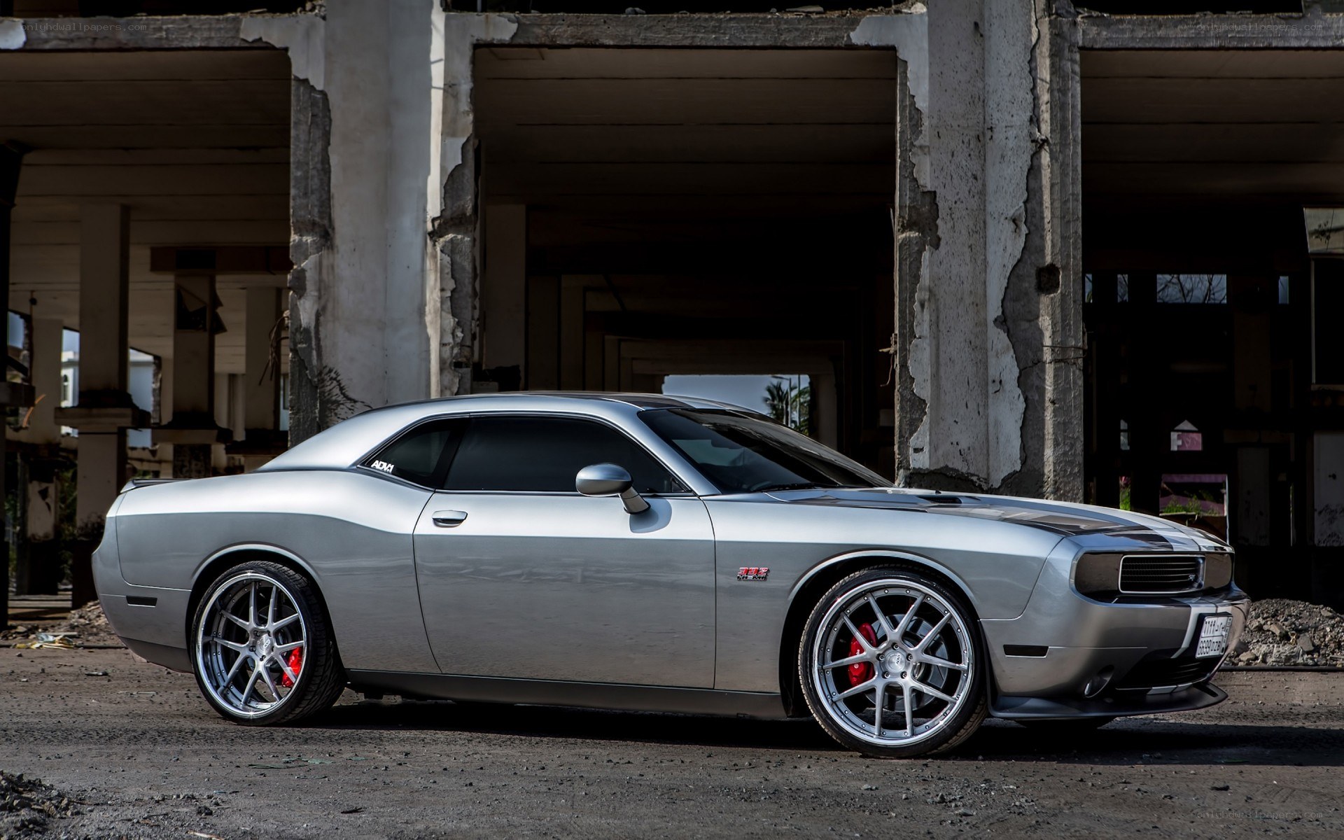 Silver Dodge Challenger in ruins
