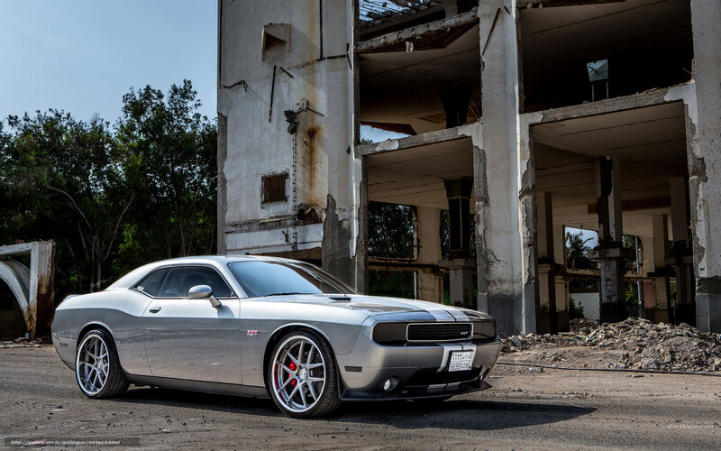 Silver Dodge Challenger in ruins