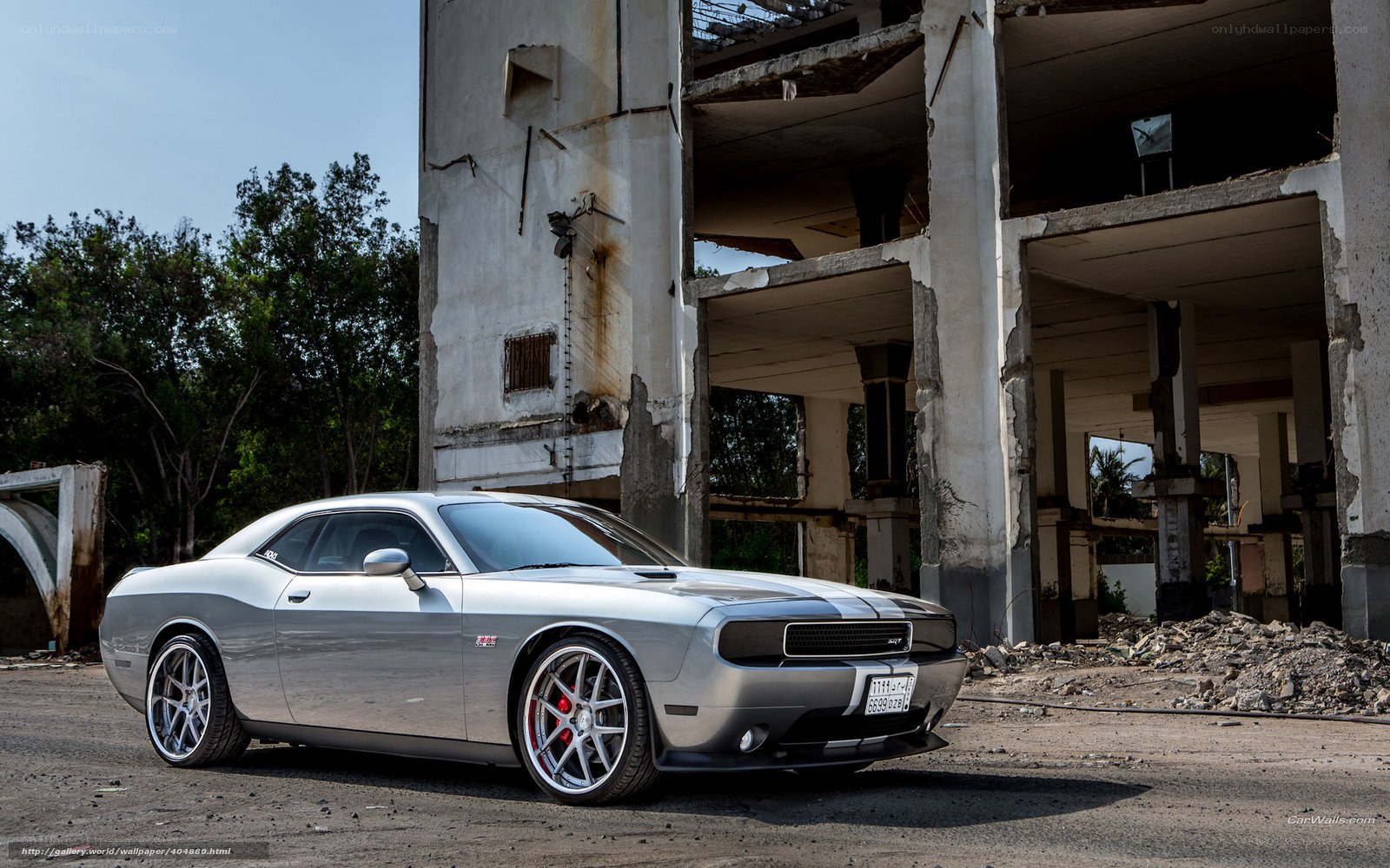 Silver Dodge Challenger in ruins