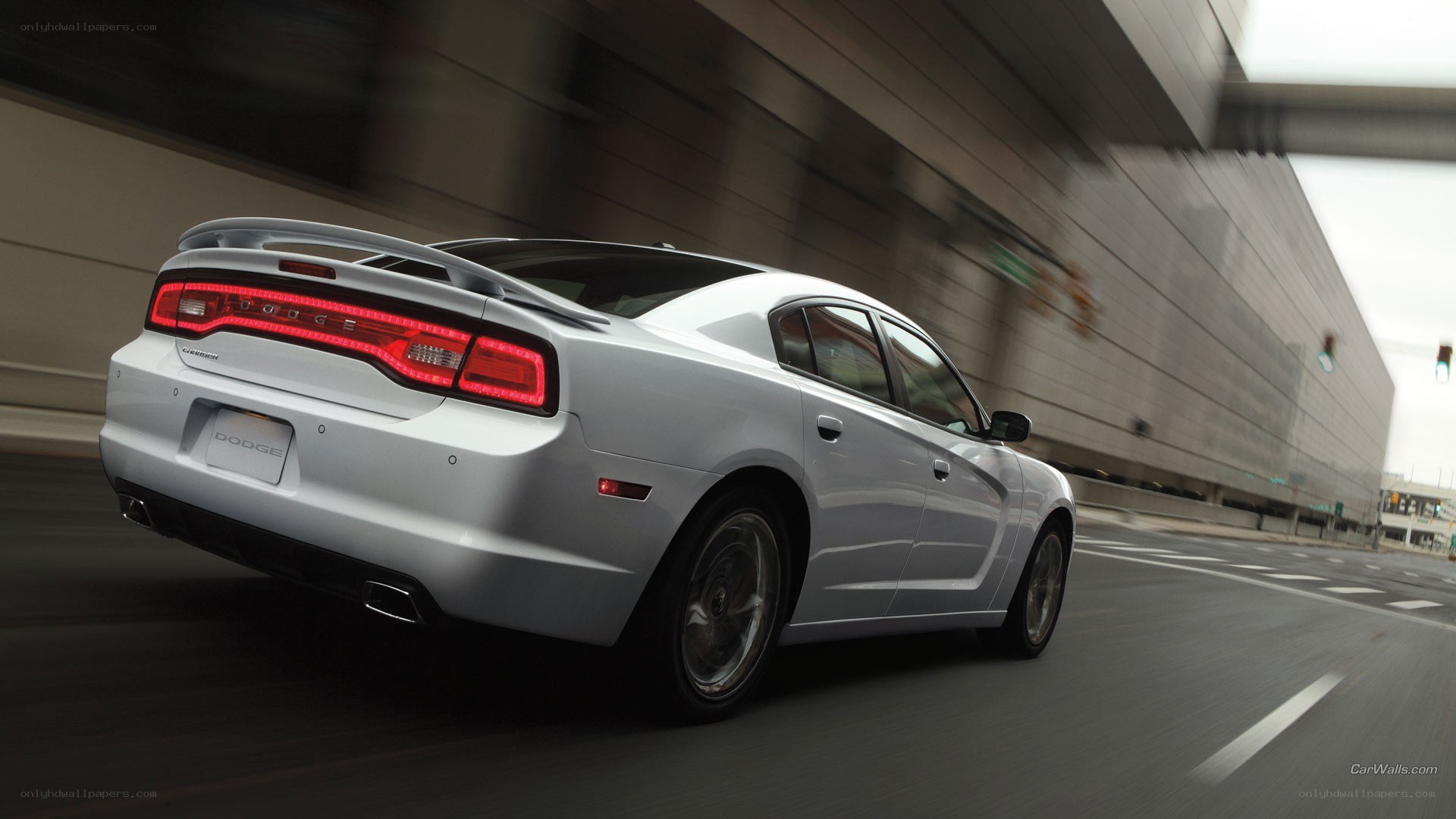 silver dodge charger in motion