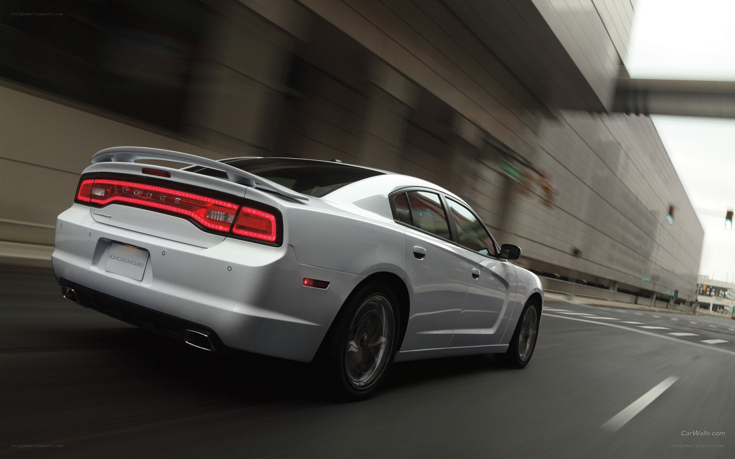 silver dodge charger in motion