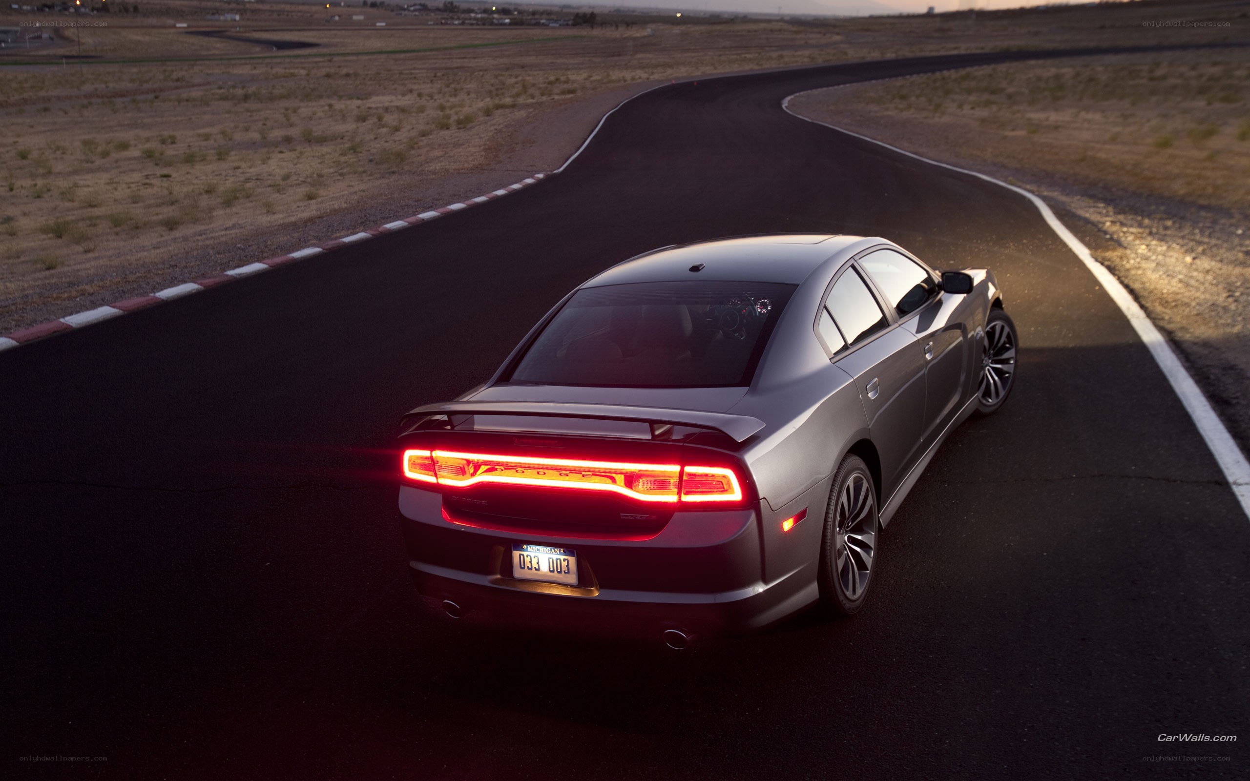 silver dodge charger on track