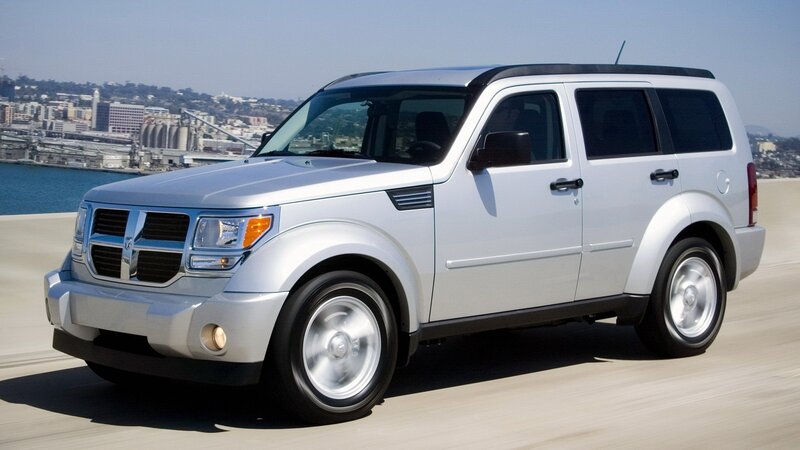 Silver Dodge Durango driving on road